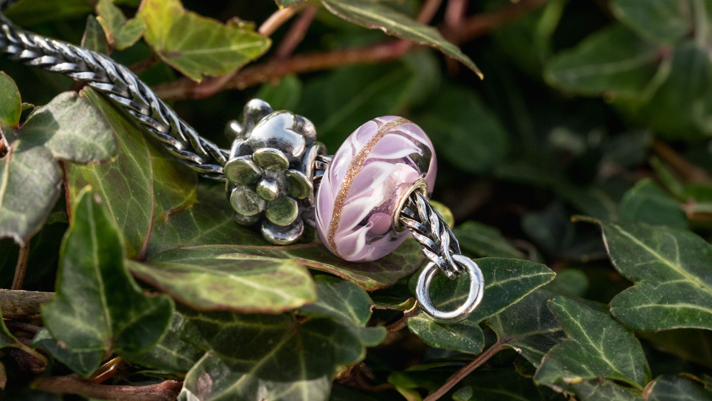 Trollbeads Heartfelt bloom silver bead & Lavender Love glass bead on a bead of leaves