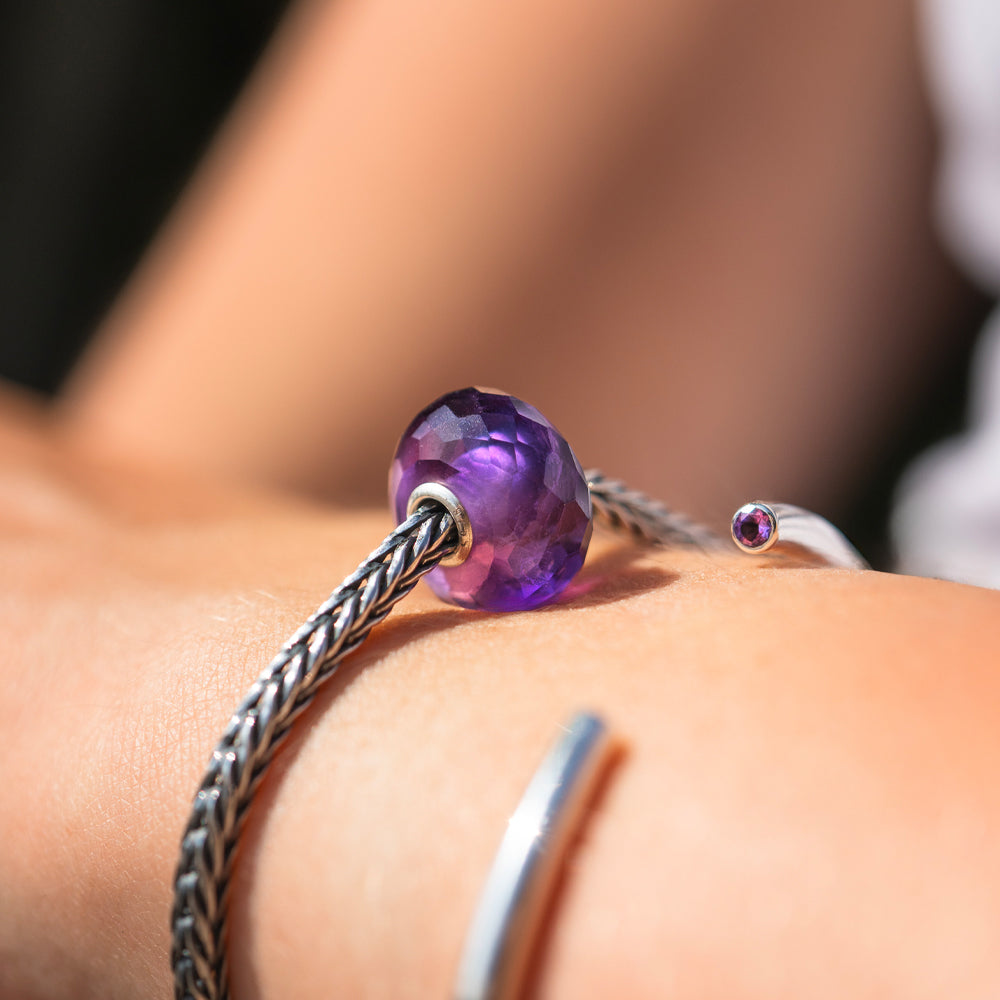 Facetted natural purple amethyst stone bead on silver bracelet and silver bangle with amethyst at each end
