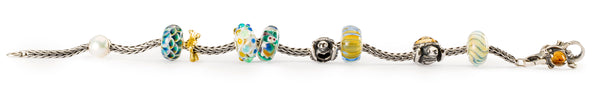 Trollbeads bracelet with turtle and ocean themed beads in glass and silver